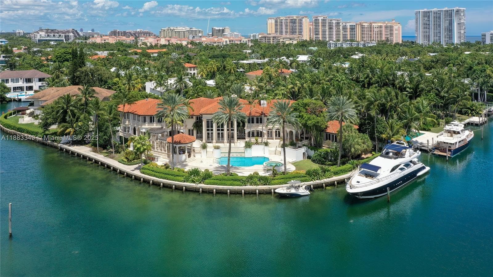 To the right of the house is a 98-foot yacht. The vast views of the water are not blocked.